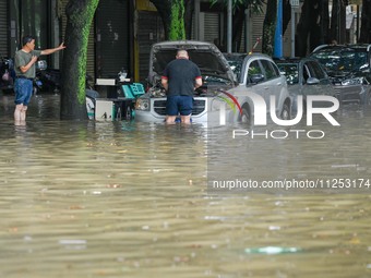 Vehicles are being stranded on a flooded road after heavy rains in Nanning, Guangxi province, China, on May 19, 2024. (