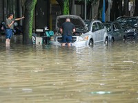 Vehicles are being stranded on a flooded road after heavy rains in Nanning, Guangxi province, China, on May 19, 2024. (