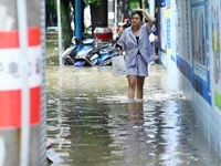 Vehicles are being stranded on a flooded road after heavy rains in Nanning, Guangxi province, China, on May 19, 2024. (