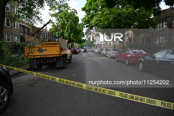 Police tape is blocking off traffic at the crime scene. A 35-year-old male victim is being shot and is in critical condition in Chicago, Ill...