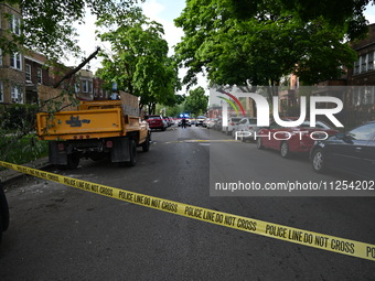 Police tape is blocking off traffic at the crime scene. A 35-year-old male victim is being shot and is in critical condition in Chicago, Ill...