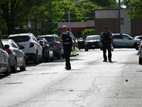 Police officers are at the scene and are recovering shell casings at the crime scene. A 29-year-old male is critically wounded after being s...