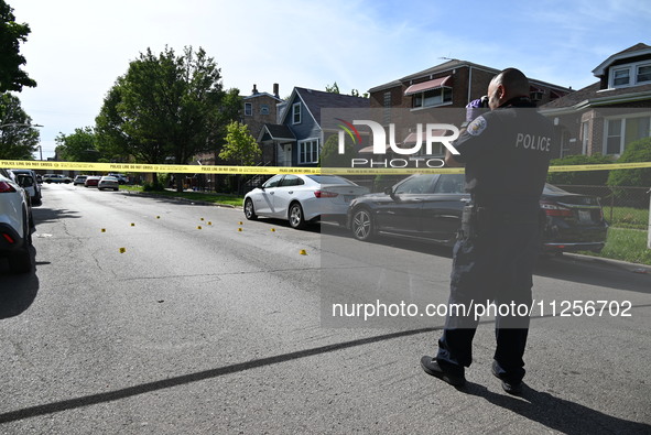 A police officer is at the scene, and shell casings are being recovered at the crime scene. A 29-year-old male is being critically wounded a...