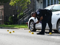 A police officer is at the scene, and shell casings are being recovered at the crime scene. A 29-year-old male is being critically wounded a...