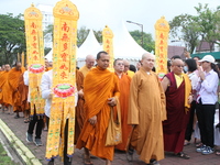 Monks are being greeted by their congregation while attending the 2024 Vesak Day commemoration event organized by Buddhists and the Medan Ci...