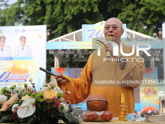 The monk, Ven Hai Thao, who is brought in from Taiwan, is giving lectures and prayers to his congregation during the 2024 Vesak Day commemor...