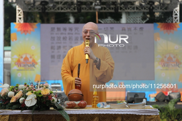 The monk, Ven Hai Thao, who is brought in from Taiwan, is giving lectures and prayers to his congregation during the 2024 Vesak Day commemor...