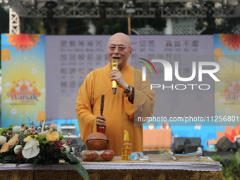 The monk, Ven Hai Thao, who is brought in from Taiwan, is giving lectures and prayers to his congregation during the 2024 Vesak Day commemor...