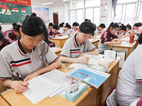 Grade three high school students who are about to take the National college entrance examination are reviewing in a self-study class at Gany...