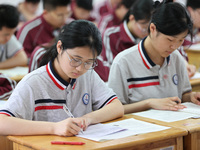 Grade three high school students who are about to take the National college entrance examination are reviewing in a self-study class at Gany...