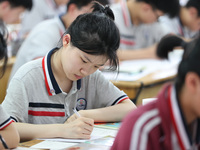 Grade three high school students who are about to take the National college entrance examination are reviewing in a self-study class at Gany...