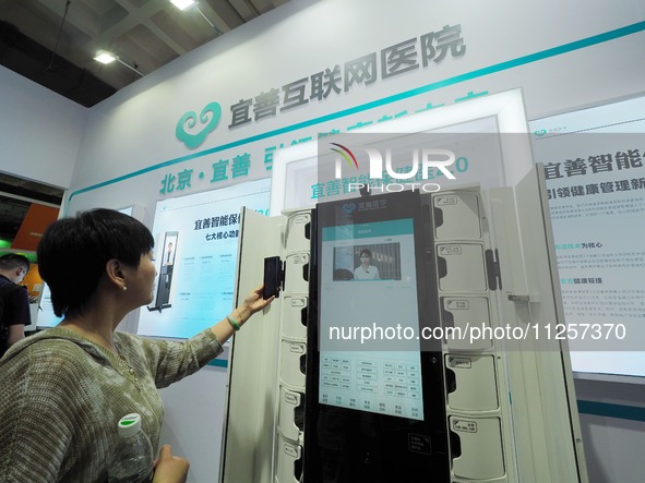 Visitors are visiting a ''smart Health care'' system at the 32nd China International Health Industry Expo in Beijing, China, on May 20, 2024...