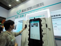 Visitors are visiting a ''smart Health care'' system at the 32nd China International Health Industry Expo in Beijing, China, on May 20, 2024...