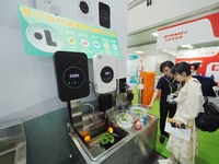 Visitors are visiting a ''food ingredients purification machine'' at the 32nd China International Health Industry Expo in Beijing, China, on...