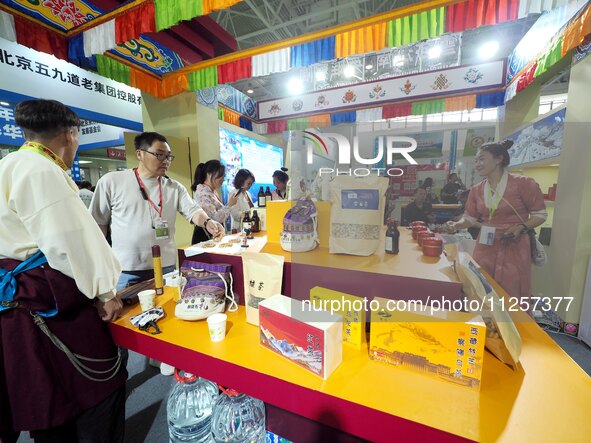 Visitors are visiting the green food exhibition area of the 32nd China International Health Industry Expo in Beijing, China, on May 20, 2024...