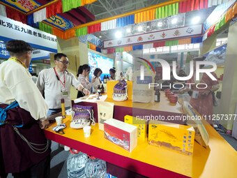 Visitors are visiting the green food exhibition area of the 32nd China International Health Industry Expo in Beijing, China, on May 20, 2024...