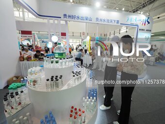 Visitors are visiting the green food exhibition area of the 32nd China International Health Industry Expo in Beijing, China, on May 20, 2024...