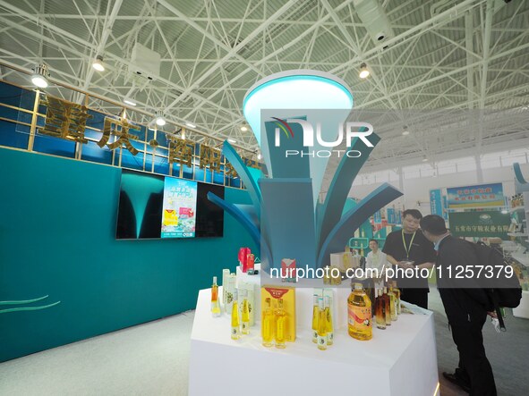 Visitors are visiting the green food exhibition area of the 32nd China International Health Industry Expo in Beijing, China, on May 20, 2024...