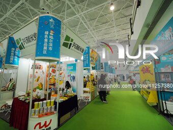 Visitors are visiting the green food exhibition area of the 32nd China International Health Industry Expo in Beijing, China, on May 20, 2024...