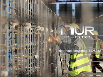 Workers are working at the construction site of a highway in Jiangbian village, Liuzhou city, South China's Guangxi Zhuang Autonomous region...