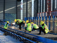 Workers are working at the construction site of a highway in Jiangbian village, Liuzhou city, South China's Guangxi Zhuang Autonomous region...