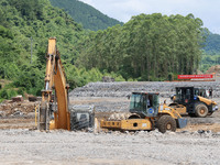 Workers are working at the construction site of a highway in Jiangbian village, Liuzhou city, South China's Guangxi Zhuang Autonomous region...