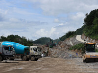 Workers are working at the construction site of a highway in Jiangbian village, Liuzhou city, South China's Guangxi Zhuang Autonomous region...