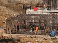 Workers are working at the construction site of a highway in Jiangbian village, Liuzhou city, South China's Guangxi Zhuang Autonomous region...