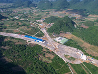 Workers are working at the construction site of a highway in Jiangbian village, Liuzhou city, South China's Guangxi Zhuang Autonomous region...