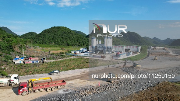 Workers are working at the construction site of a highway in Jiangbian village, Liuzhou city, South China's Guangxi Zhuang Autonomous region...