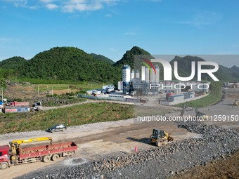 Workers are working at the construction site of a highway in Jiangbian village, Liuzhou city, South China's Guangxi Zhuang Autonomous region...