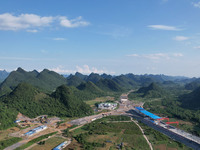 Workers are working at the construction site of a highway in Jiangbian village, Liuzhou city, South China's Guangxi Zhuang Autonomous region...