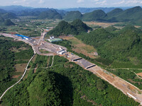 Workers are working at the construction site of a highway in Jiangbian village, Liuzhou city, South China's Guangxi Zhuang Autonomous region...