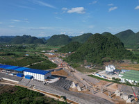 Workers are working at the construction site of a highway in Jiangbian village, Liuzhou city, South China's Guangxi Zhuang Autonomous region...