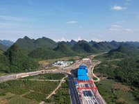 Workers are working at the construction site of a highway in Jiangbian village, Liuzhou city, South China's Guangxi Zhuang Autonomous region...