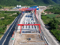 Workers are working at the construction site of a highway in Jiangbian village, Liuzhou city, South China's Guangxi Zhuang Autonomous region...