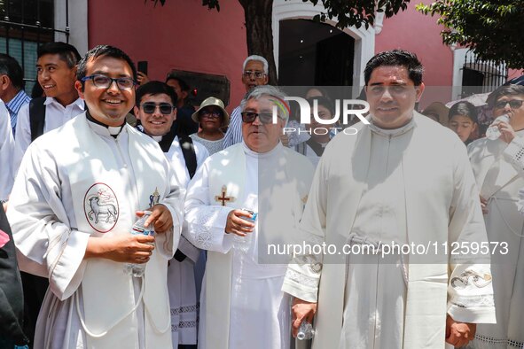 Priests are taking part in the traditional downing of the Virgen de Ocotlan. In this procession, the virgin is visiting different emblematic...