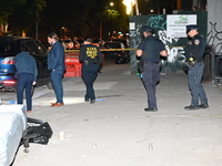 Police officers are converging and gathering at the crime scene. A 24-year-old male, Brandon Dubois, is being shot multiple times and killed...