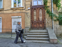 A woman is being seen in a courtyard in the historic city center in Odesa, Ukraine, on May 20, 2024. NO USE RUSSIA. NO USE BELARUS. (