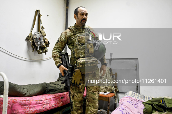 A fighter of the 53rd Battalion of the 141st Separate Infantry Brigade is serving in the Zaporizhzhia region, Ukraine, on May 20, 2024. NO U...