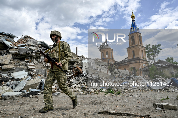 Fighters of the 53rd Battalion of the 141st Separate Infantry Brigade are serving in the Zaporizhzhia region, Ukraine, on May 20, 2024. NO U...