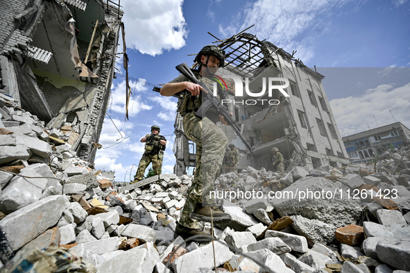 A fighter of the 53rd Battalion of the 141st Separate Infantry Brigade is serving in the Zaporizhzhia region, Ukraine, on May 20, 2024. NO U...