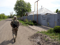 A serviceman is patrolling the streets in Chasiv Yar, Donetsk region, eastern Ukraine, on May 18, 2024. NO USE RUSSIA. NO USE BELARUS. (