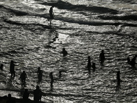 Palestinians are gathering on the beach in Deir el-Balah in the central Gaza Strip, on May 21, 2024, amid the ongoing conflict between Israe...