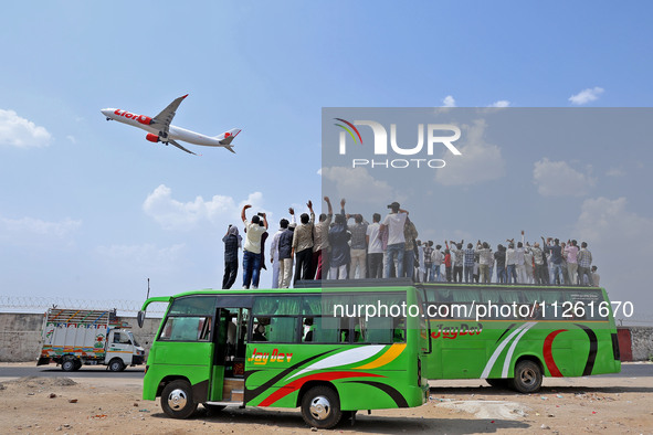 Relatives are standing atop buses as they see off Haj pilgrims, leaving on a flight, in Jaipur, Rajasthan, India, on May 21, 2024. 