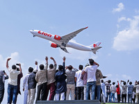 Relatives are standing atop buses as they see off Haj pilgrims, leaving on a flight, in Jaipur, Rajasthan, India, on May 21, 2024. (