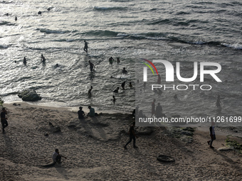 Palestinians are gathering on the beach in Deir el-Balah in the central Gaza Strip, on May 21, 2024, amid the ongoing conflict between Israe...