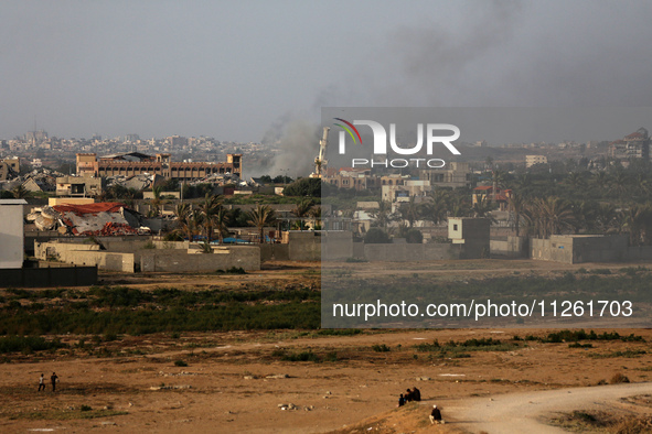 Smoke is billowing after Israeli bombardment in the central Gaza Strip on May 21, 2024, amid the ongoing conflict between Israel and the mil...