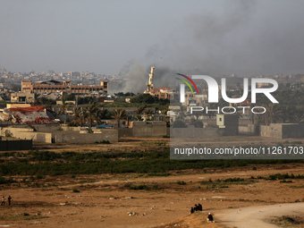 Smoke is billowing after Israeli bombardment in the central Gaza Strip on May 21, 2024, amid the ongoing conflict between Israel and the mil...