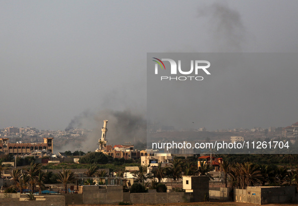 Smoke is billowing after Israeli bombardment in the central Gaza Strip on May 21, 2024, amid the ongoing conflict between Israel and the mil...